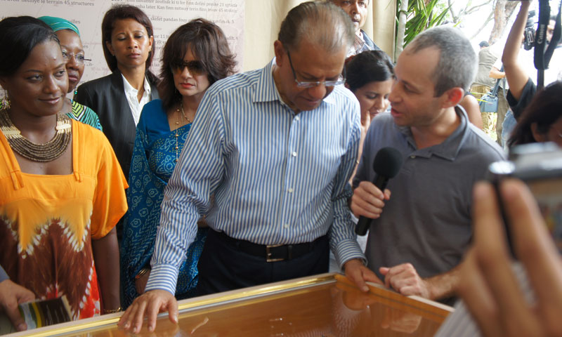 Dr. Chip Colwell-Chanthaphonh (right) talks to the Prime Minister of Mauritius, Dr. Navin Ramgoolam. The two crossed paths at an exhibit for the 178th anniversary of the abolition of slavery. Dr. Chip helped develop the exhibit, which attracted thousands of Mauritians during the 10 days it was on display.