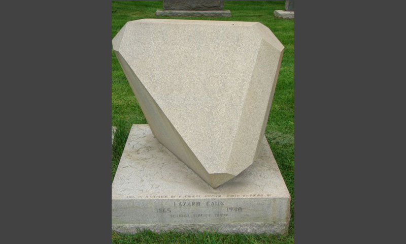 The headstone of Lazard Cahn, an internationally renowned mineral morphologist and Willet Willis's mentor, is shaped like the mineral named for Cahn-the twinned mineral cahnite.  (© Jennifer Root)
